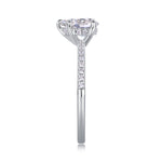 CARISSIE pear moissanite solitaire ring side profile, showing tapered band thickness and accent stones
