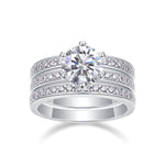 CARISSIE round moissanite solitaire ring set, straight-on perspective capturing full width of the unified three-ring stack