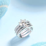 CARISSIE round moissanite solitaire ring set, angled studio view of stacked rings showcasing side profile brilliance
