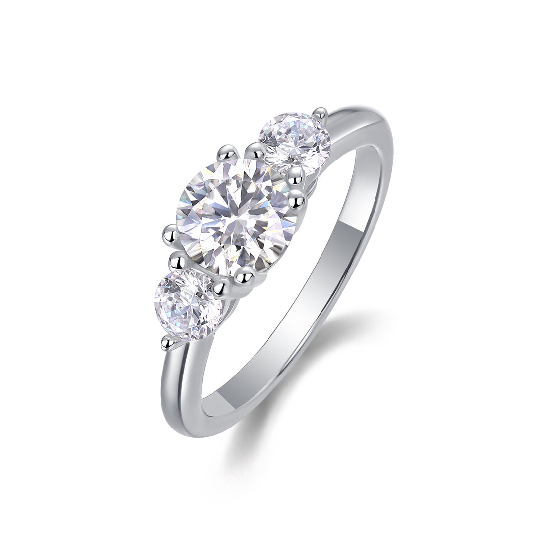 CARISSIE round moissanite solitaire ring, angled view highlighting the central stone and bead prongs on a polished silver band