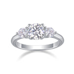 CARISSIE round moissanite solitaire ring, front view displaying the three-stone arrangement with brilliant-cut center gem