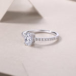 CARISSIE oval moissanite solitaire ring close-up angle showing S925 hallmark inside shank and polished silver finish