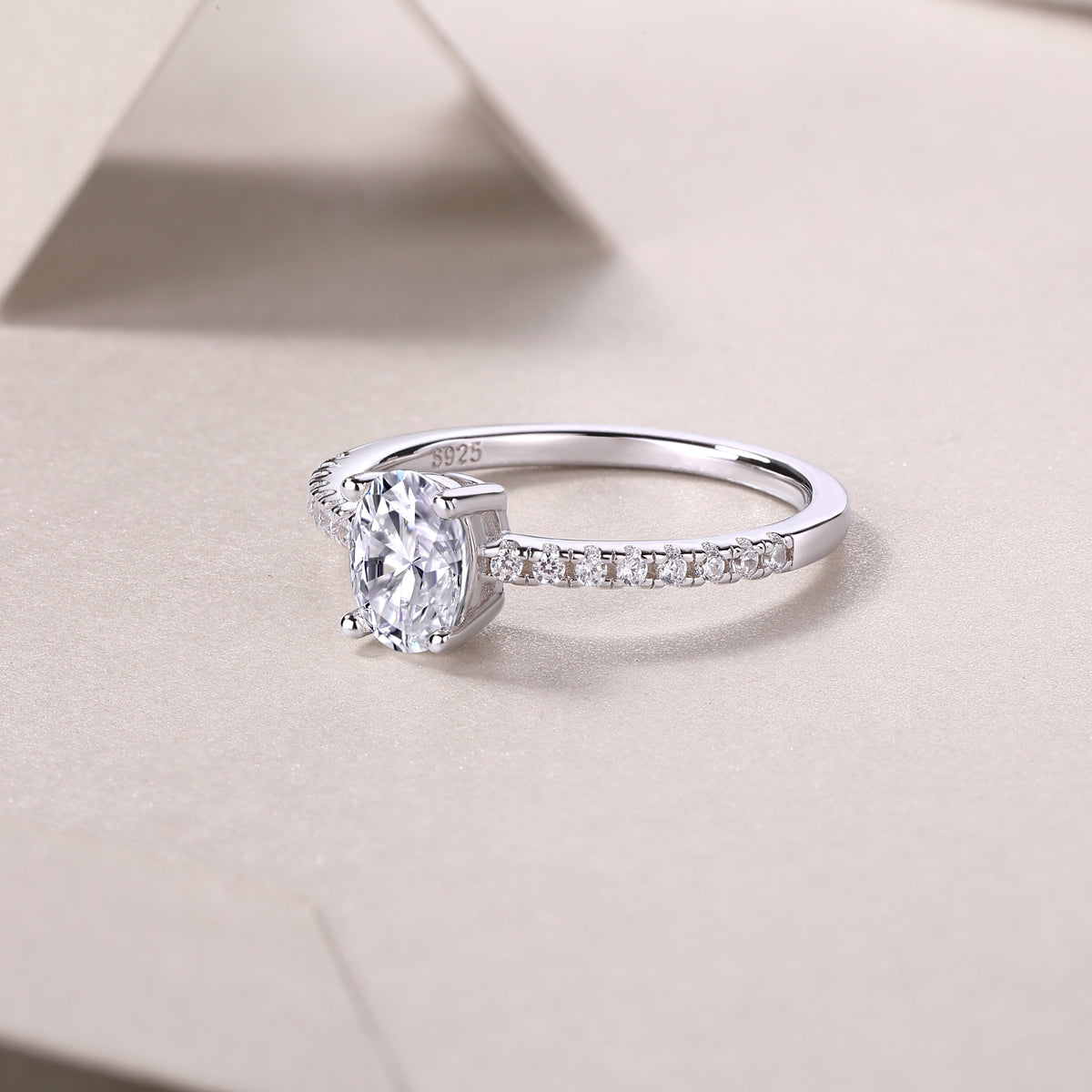 CARISSIE oval moissanite solitaire ring close-up angle showing S925 hallmark inside shank and polished silver finish