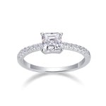 CARISSIE Asscher solitaire engagement ring front view, showcasing the symmetrical square stone and round accent stones in white metal