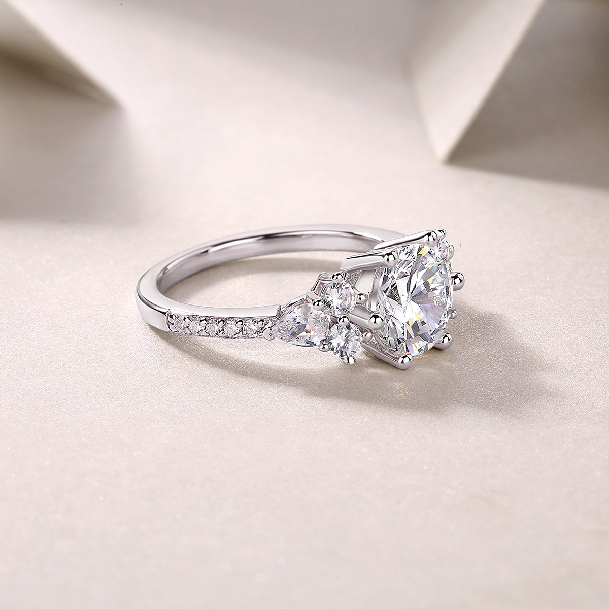 CARISSIE round moissanite solitaire ring lifestyle angle, emphasizing the smooth silver-tone band and clarity