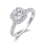 CARISSIE round moissanite halo ring high angle close-up, revealing prong setting and sparkle of stones
