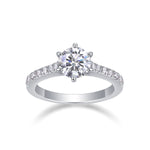 CARISSIE round moissanite solitaire ring, front view highlighting the brilliant center stone and silver-tone metal