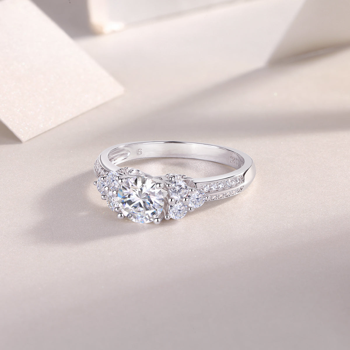 CARISSIE round moissanite solitaire ring, interior view displaying the smooth white metal band finish and stamped hallmark