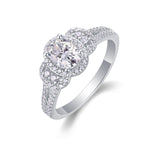 CARISSIE oval moissanite halo ring angled studio shot revealing prong setting and concentric diamond halos