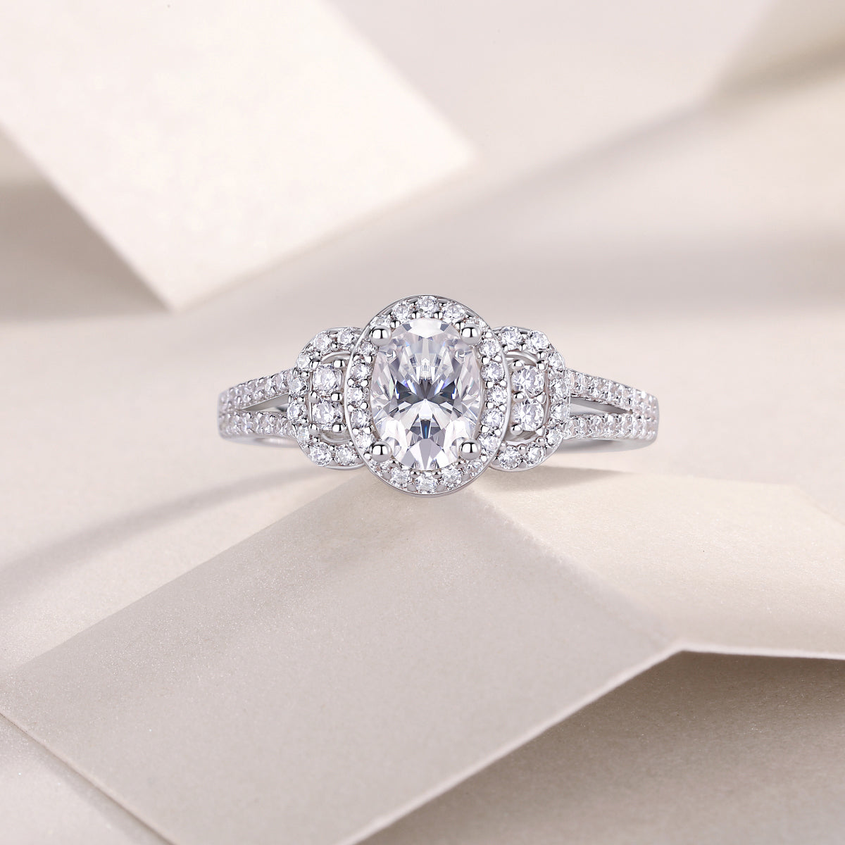 CARISSIE oval moissanite halo ring top-down view on soft background, illustrating symmetrical halo arrangement