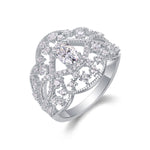 CARISSIE oval moissanite solitaire ring, angled close-up displaying heavy head structure and detailed accent stones