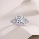 CARISSIE round moissanite halo ring, top-down perspective on soft folds emphasizing the symmetrical cushion-shaped halo