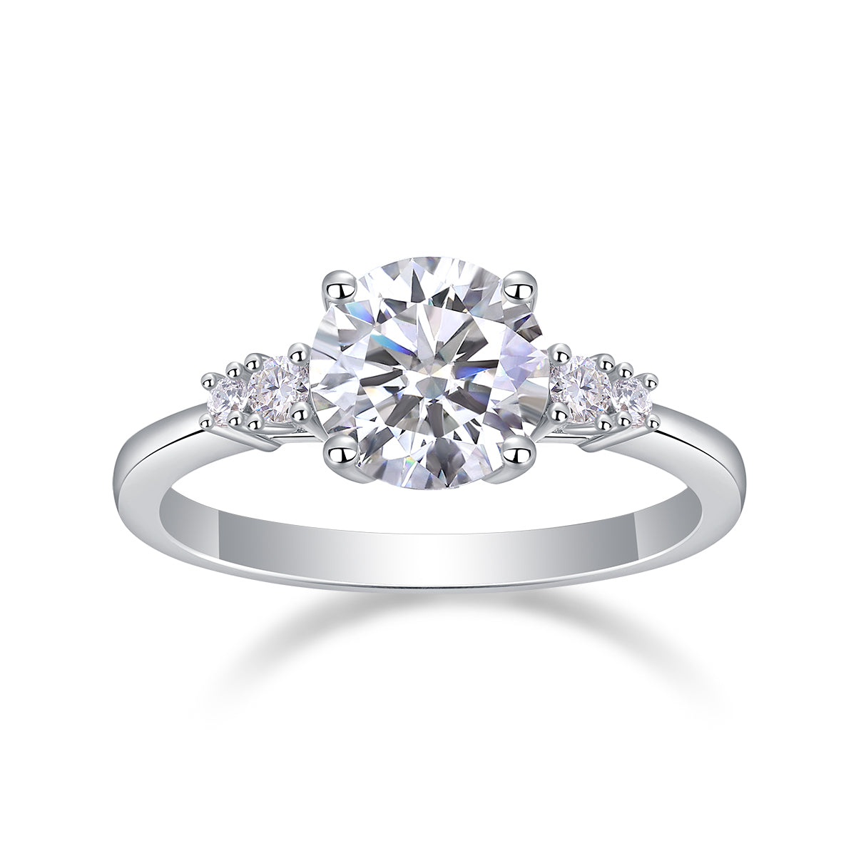 CARISSIE round moissanite solitaire ring, direct front view highlighting the brilliant-cut centerpiece flanked by smaller stones