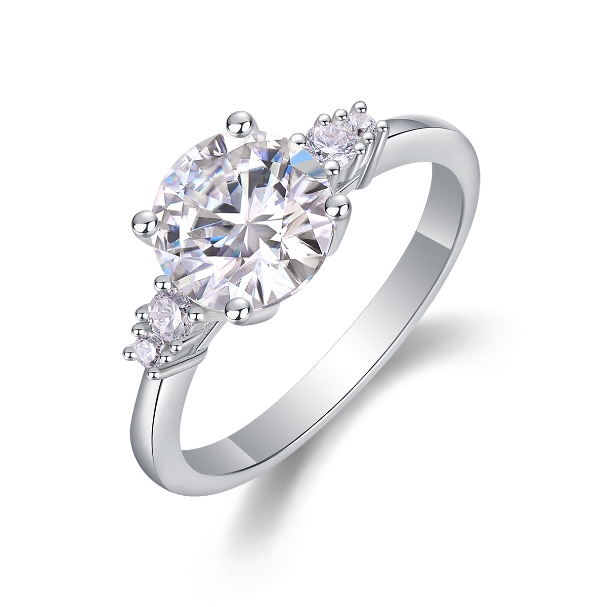 CARISSIE round moissanite engagement ring, angled view showing large center stone and asymmetric side clusters on silver band