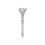 CARISSIE round moissanite solitaire ring, top-down profile showing high-set prongs and row of accent stones on band