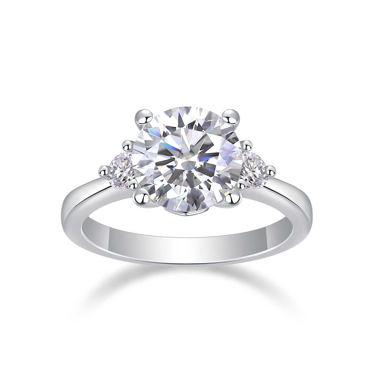 CARISSIE three-stone moissanite ring, front view highlighting symmetrical round brilliant cut gems and prong details