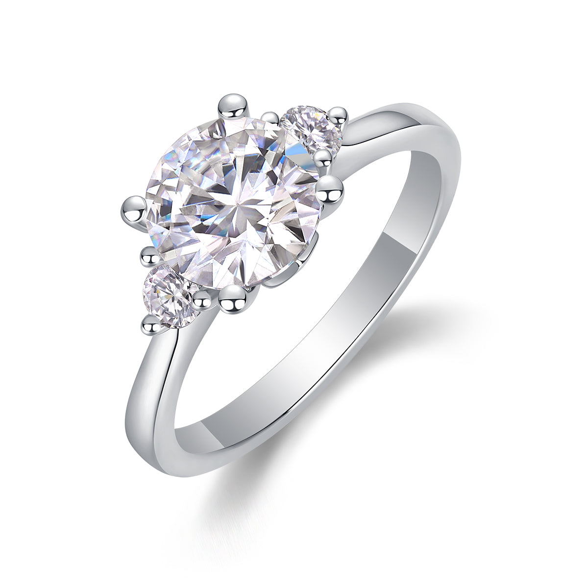 CARISSIE round moissanite engagement ring, angled view showing large center stone and side stones in polished silver setting