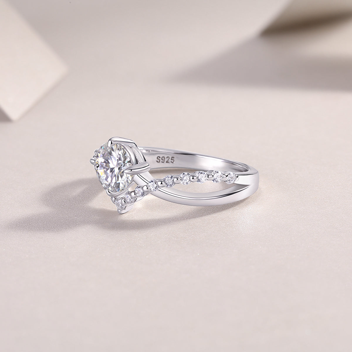 CARISSIE round moissanite solitaire ring, close-up interior view showing S925 sterling silver stamp and smooth polished finish