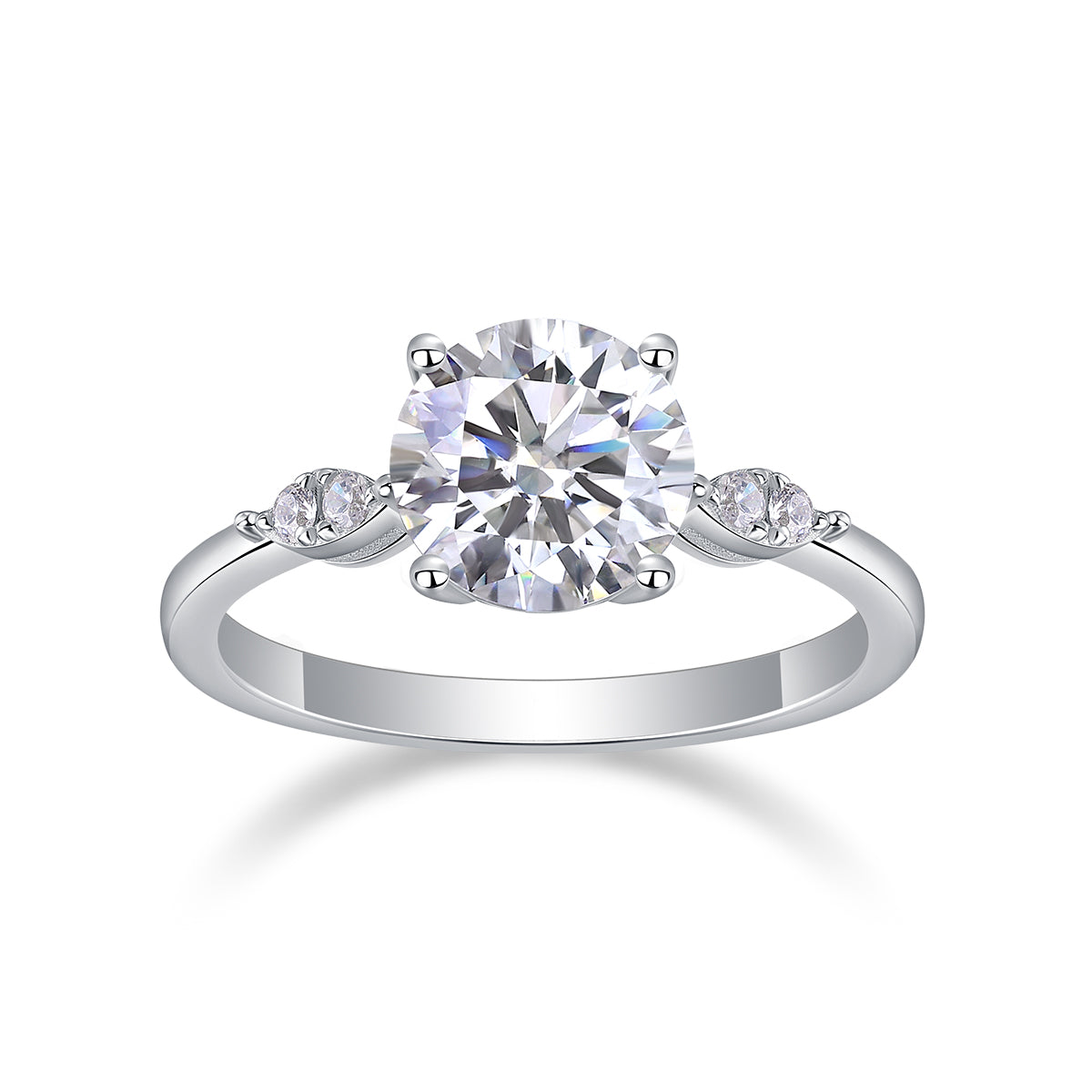 CARISSIE round moissanite solitaire ring, front view displaying large center stone in four-prong setting with side clusters