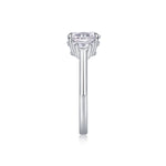 CARISSIE oval moissanite solitaire ring, straight side profile revealing the slender shank and elevation of the prong setting