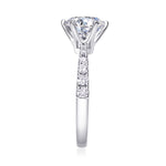 CARISSIE round moissanite solitaire ring, side view emphasizing the gallery rail and graduated pave accents on shank