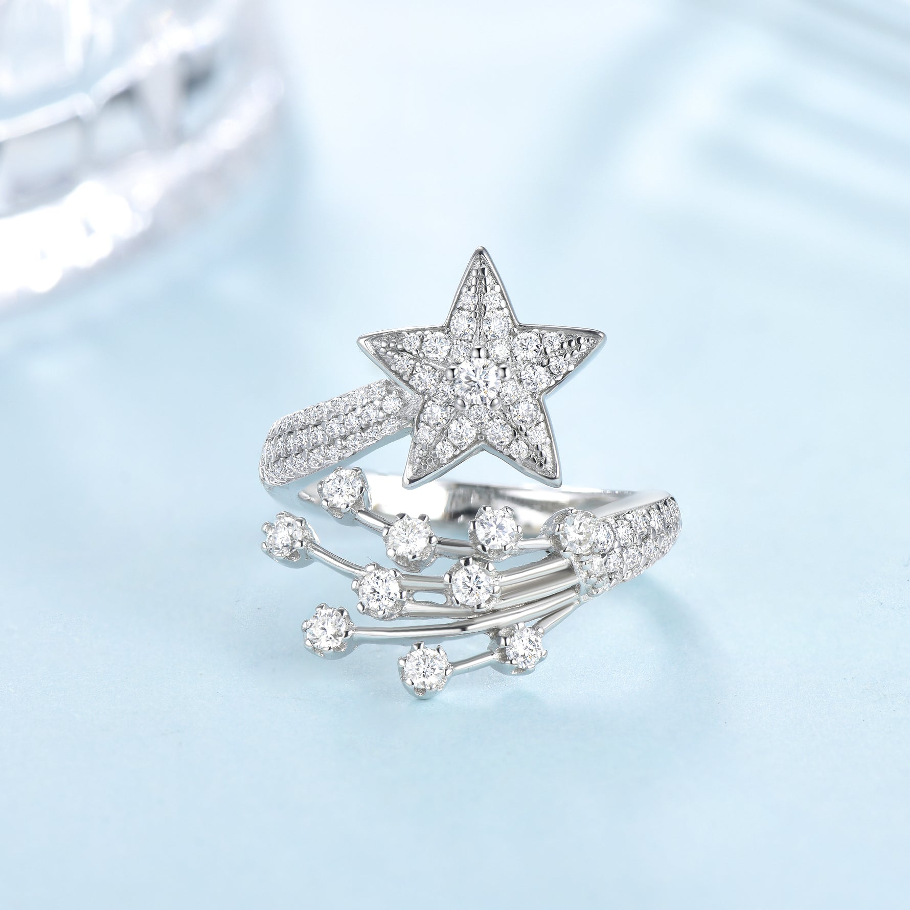 CARISSIE round moissanite cluster engagement ring, angled view highlighting the five-pointed star head with central stone