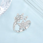 CARISSIE round moissanite cluster engagement ring, top-down perspective displaying the open split-shank design details