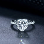 CARISSIE heart solitaire engagement ring, front view capturing fire and brilliance of the large moissanite center
