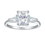 CARISSIE white gold style ring, direct front view showcasing the symmetrical arrangement of the central radiant stone and flanking baguettes