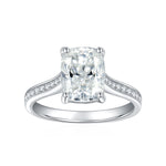 CARISSIE cushion solitaire engagement ring, close-up view detailing the four-prong setting and sparkling accent stones