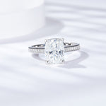 CARISSIE cushion solitaire engagement ring, front view highlighting the large moissanite stone and pavé split shank