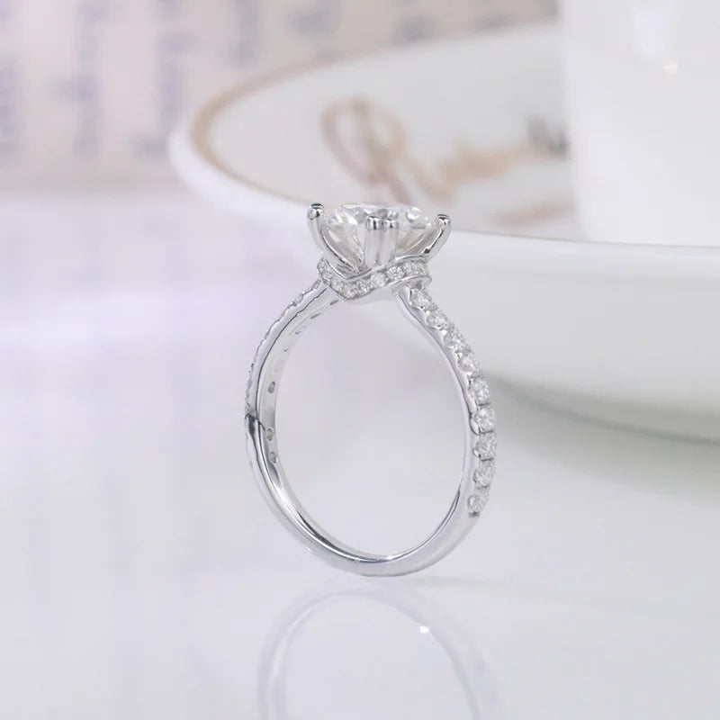 CARISSIE round moissanite solitaire ring, side profile highlighting hidden halo detail and silver-tone metal finish