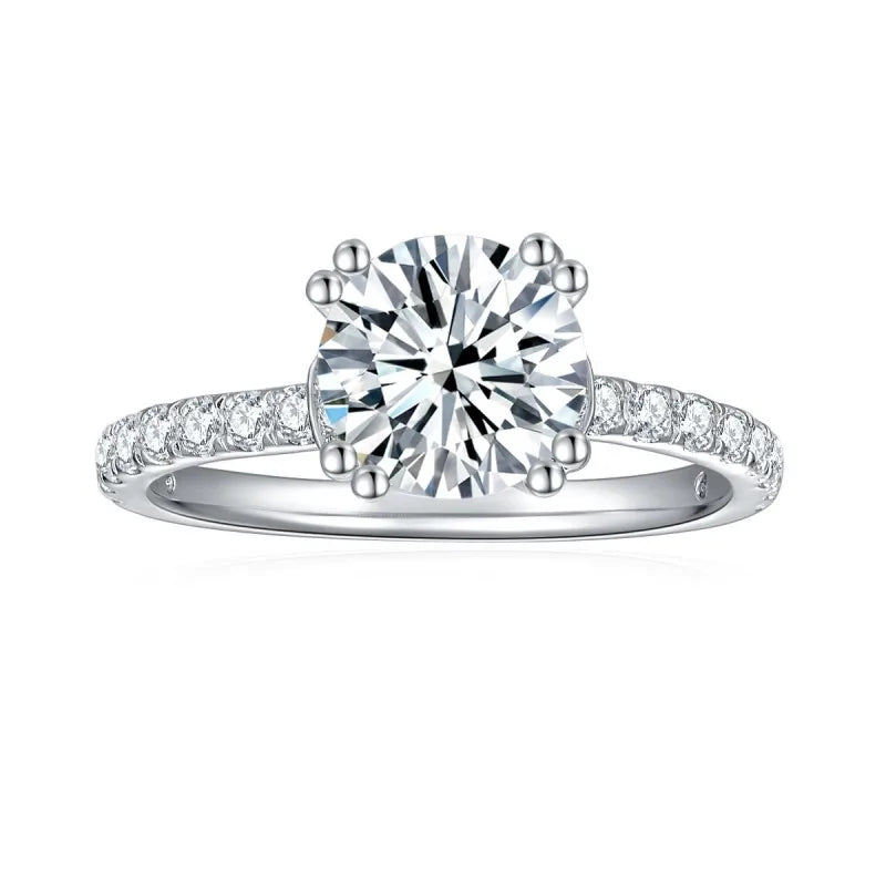 CARISSIE round moissanite solitaire ring, top-down close-up revealing brilliant cut facets and prong details