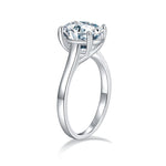 CARISSIE oval moissanite solitaire ring, side profile view revealing the elegant curve of the split shank and secure prongs