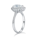 CARISSIE pear moissanite halo ring, side profile revealing the split shank design and intricate prong details supporting the head