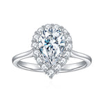 CARISSIE pear moissanite halo ring, close-up front view showcasing the detailed pavé stones in the halo and split band structure