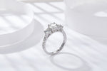 CARISSIE round moissanite solitaire ring, lifestyle shot on white display showing silver-tone metal shine