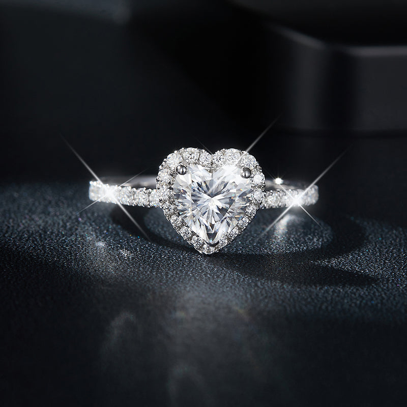 CARISSIE heart moissanite halo ring, front view showing brilliant center stone and pavé band on dark surface