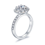 CARISSIE round moissanite halo engagement ring, angled perspective displaying the smooth polished shank and shoulder accents