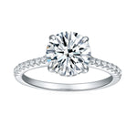 CARISSIE round moissanite solitaire ring, direct front view displaying brilliant cut center stone and symmetrical prongs on white gold shank