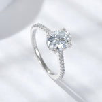 CARISSIE oval moissanite solitaire ring, angled top-down view highlighting brilliant facets of the gemstone and delicate prongs