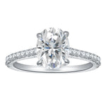 CARISSIE oval moissanite solitaire ring, front view showing large center stone and pavé diamond band in white metal setting
