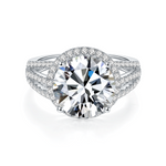 CARISSIE round moissanite solitaire ring, direct front close-up emphasizing prong details and continuous diamond halo