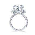 CARISSIE round moissanite solitaire ring, side profile revealing the crossover band design and pavé detailing on the shank