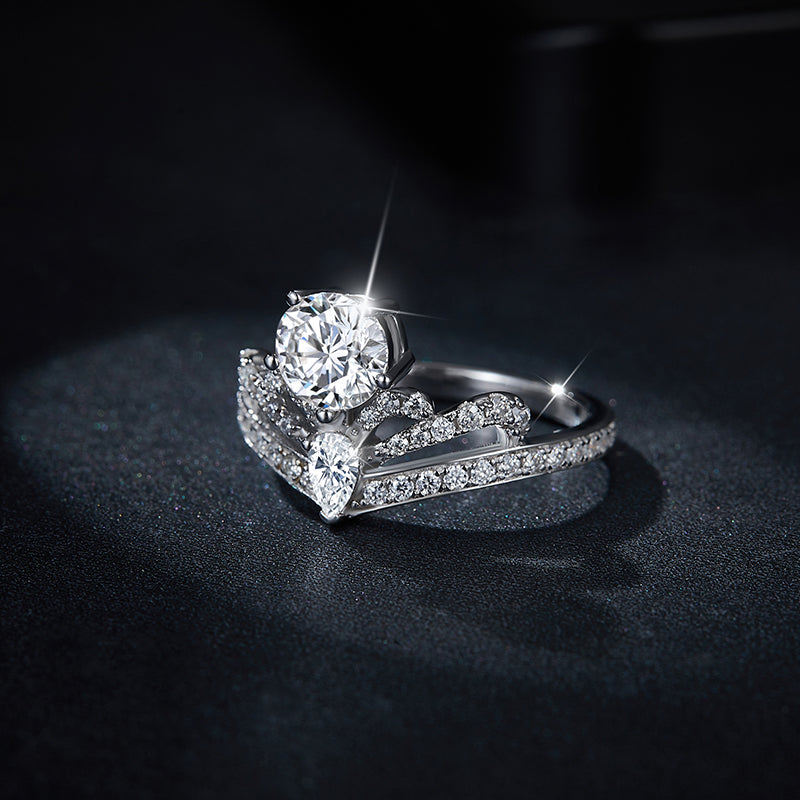 CARISSIE round moissanite solitaire ring, side profile on dark surface emphasizing the height of the center stone setting