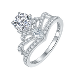 CARISSIE round moissanite solitaire ring, high-angle view highlighting the openwork crown gallery and pavé band details