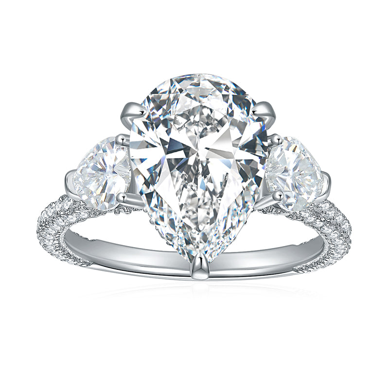 CARISSIE pear moissanite solitaire ring, front view showing large center stone and split shank pavé band
