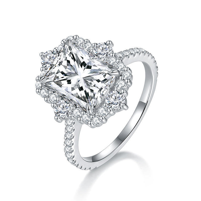 CARISSIE radiant moissanite halo engagement ring, angled view showing starburst design and pavé band