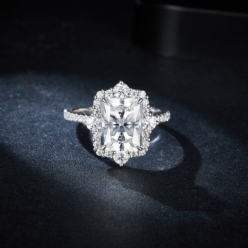 CARISSIE radiant moissanite halo engagement ring, front view displaying the X-pattern of the center stone