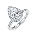 CARISSIE pear moissanite engagement ring, angled close-up showing the S925 silver hallmark inside the band and detailed pave setting